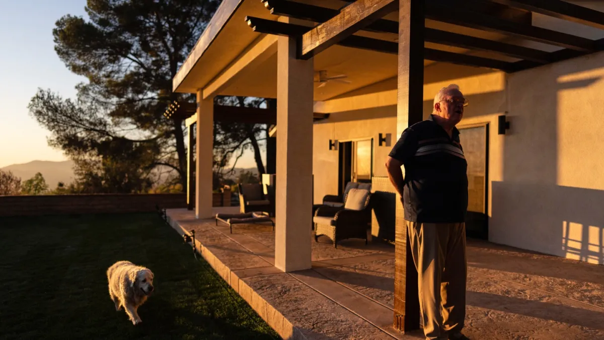 A man and his old dog are home at last after fleeing LA area fires
